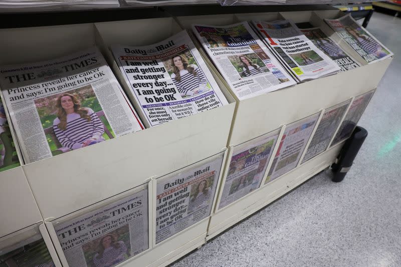 British newspapers with news of Britain's Catherine, Princess of Wales' illness are displayed at a supermarket in London