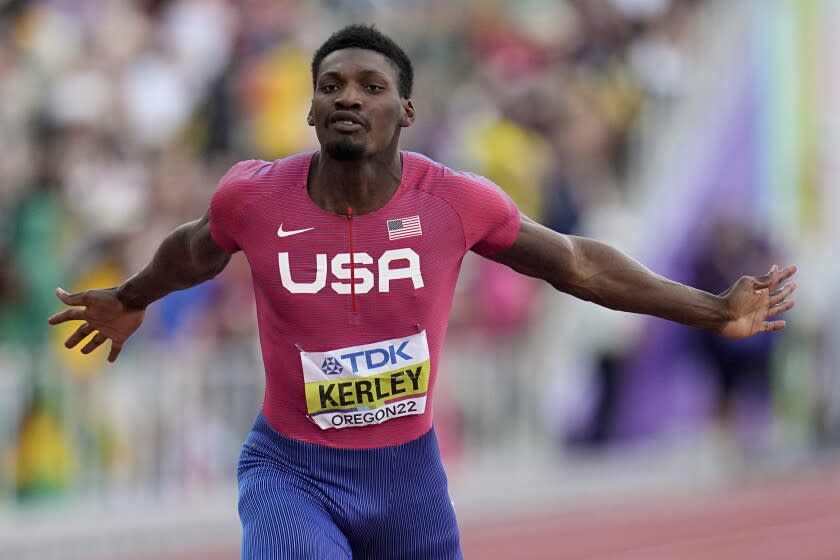 Fred Kerley, of the United States, wins the final in the men's 100-meter run.