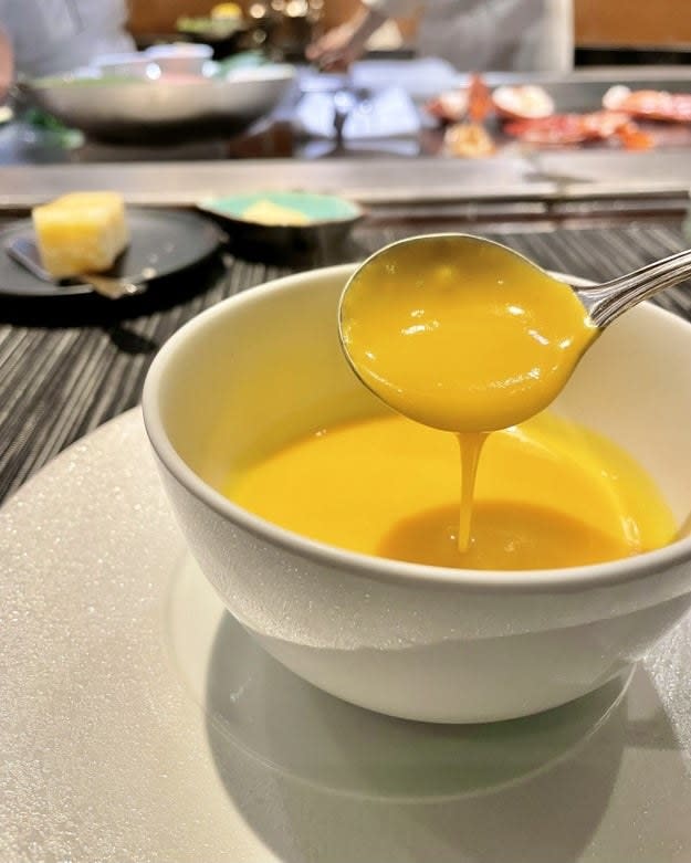 Pumpkin soup in a white bowl