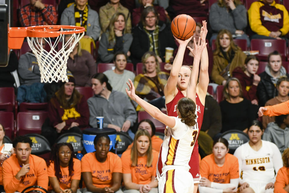 Indiana guard Grace Berger takes a shot over Minnesota guard Battle Amaya (3) during the first half of an NCAA college basketball game on Wednesday, Feb 1, 2023, in Minneapolis. (AP Photo/Craig Lassig)