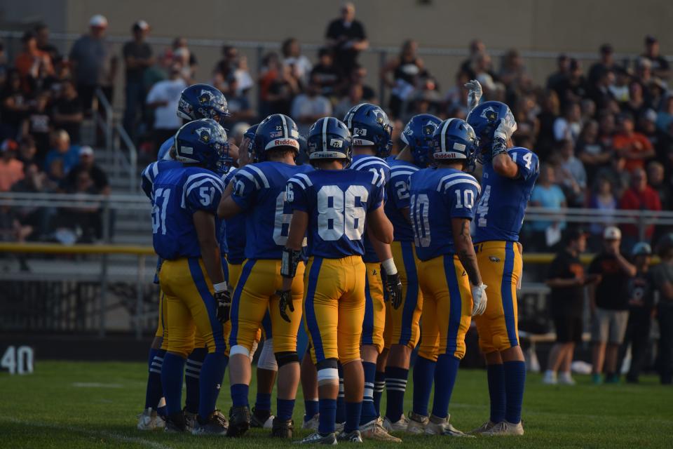 Canton huddles up before a kick-off during Friday's win over Lennox on Sep. 8.