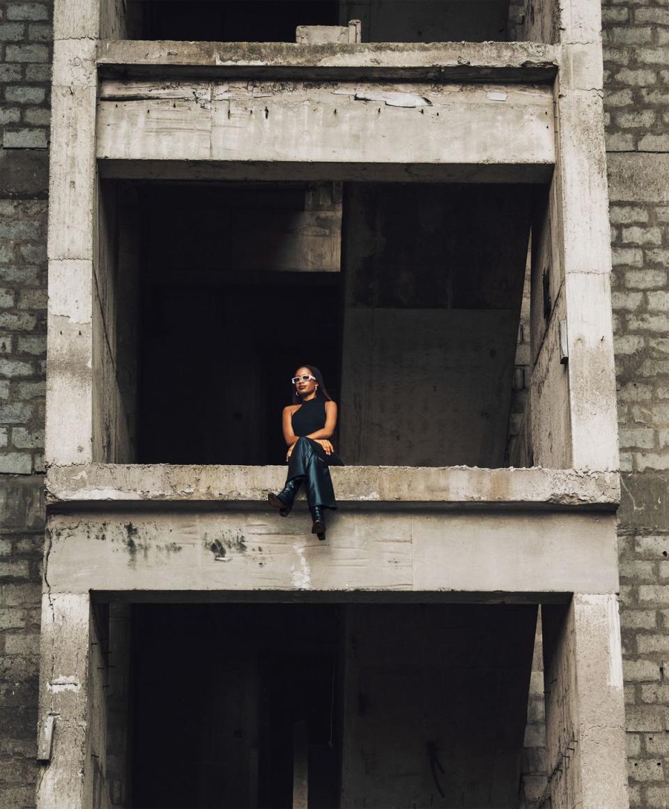 woman sitting in the middle of a construction site