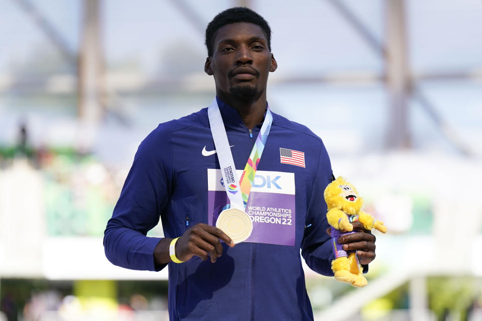 Gold medalist Fred Kerley, of the United States, stands on the podium after the final in the men's 100-meter run at the World Athletics Championships on Sunday, July 17, 2022, in Eugene, Ore. (AP Photo/Ashley Landis)