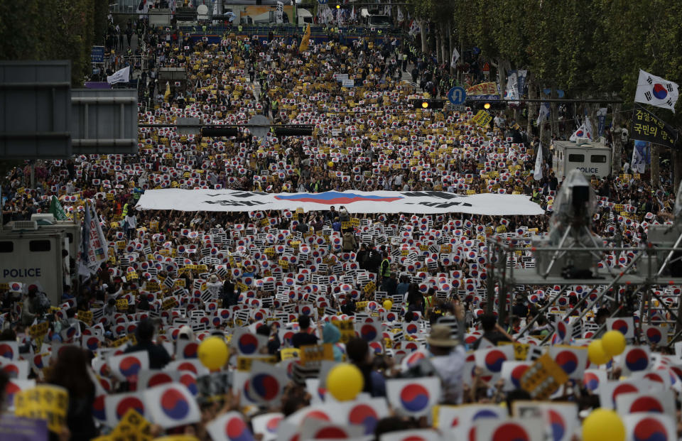 Thousands of supporters of the beleaguered South Korean Justice Minister Cho Kuk rally in front of Seoul Central District Prosecutors' Office in Seoul, South Korea, Saturday, Oct. 5, 2019. (AP Photo/Lee Jin-man)