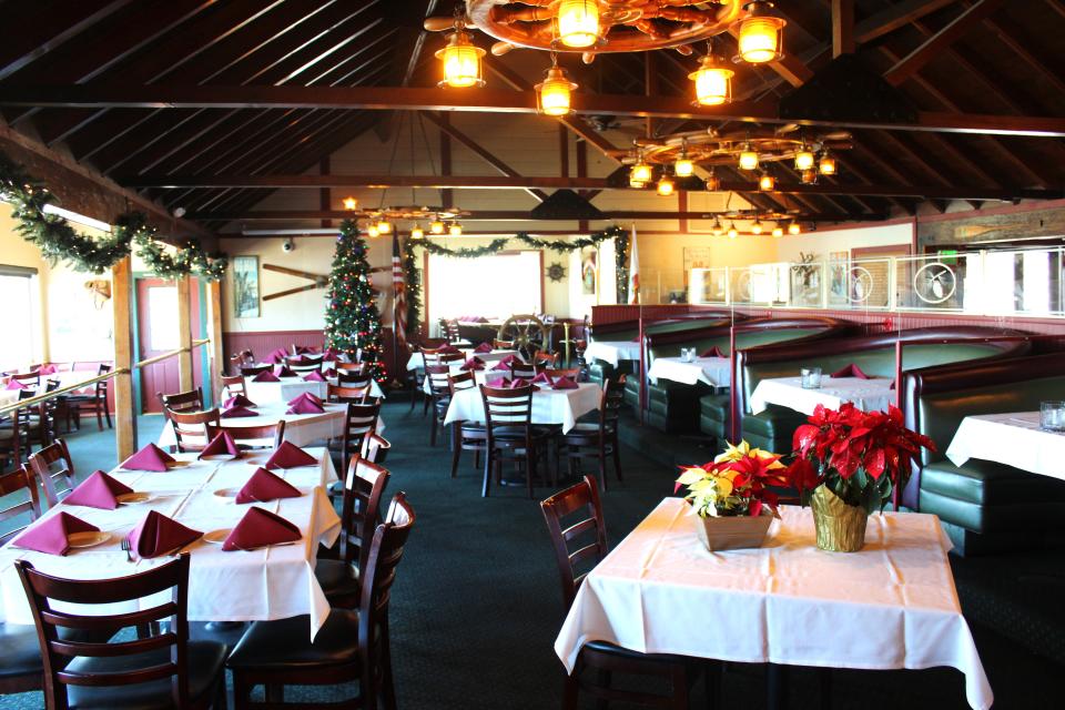 Main seating room at The Pines Lakefront, as seen on December 8, 2023. Tall backed booths for an enjoyable dining experience.