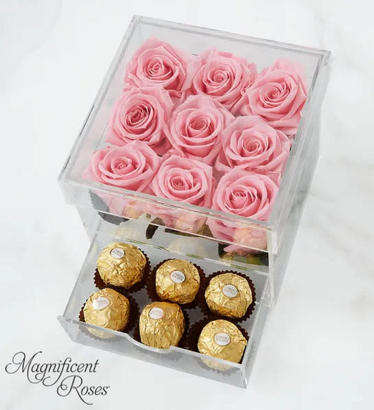 Acrylic box with 9 preserved pink roses in top section and 12 chocolates in bottom drawer. 