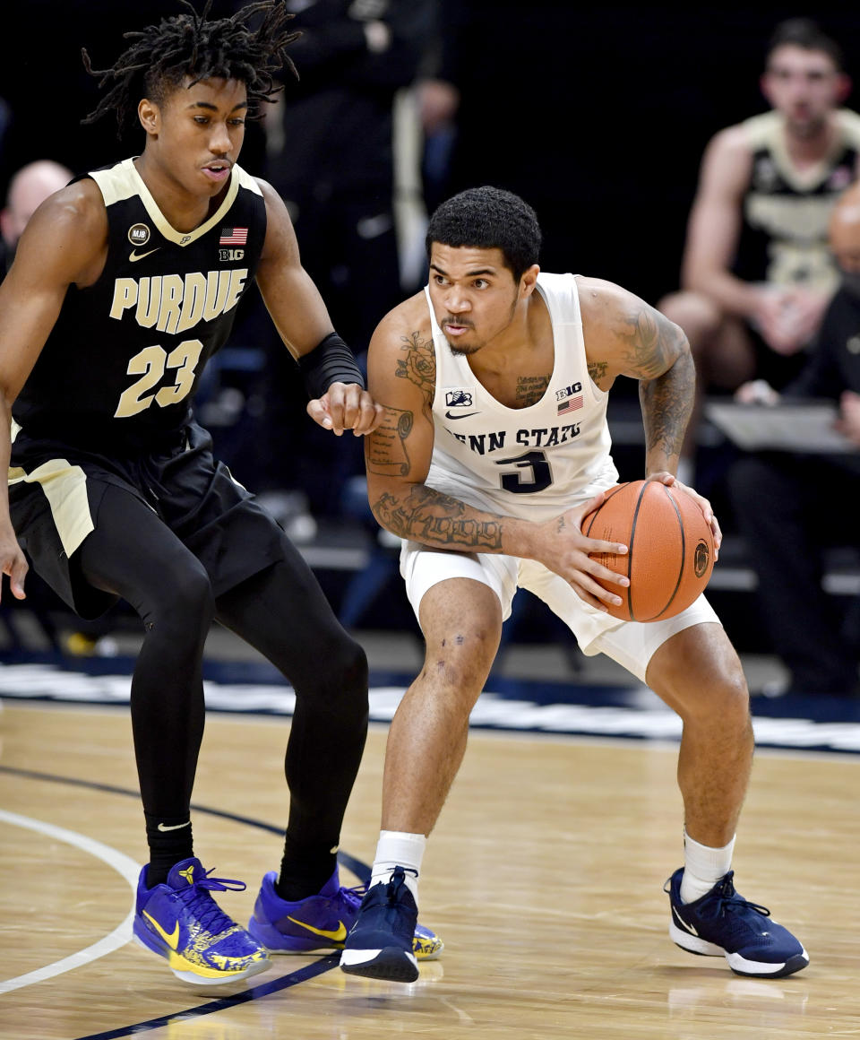 Penn State's Sam Sessoms dibbles around Purdue's Jaden Ivey uring an NCAA college basketball game Friday, Feb. 26, 2021, in State College, Pa. (Abby Drey/Centre Daily Times via AP)