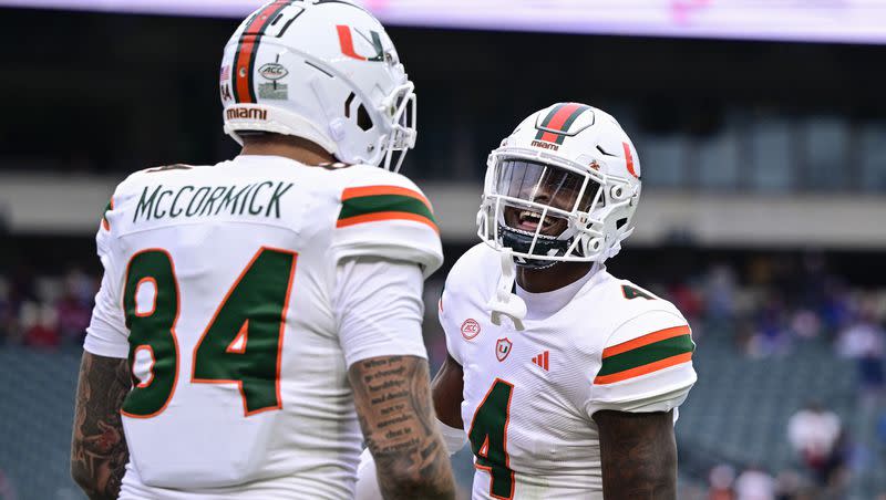 Miami wide receiver Colbie Young (4) celebrates his touchdown with Cam McCormick during an NCAA college football game against Temple on  Sept. 23, 2023, in Philadelphia.