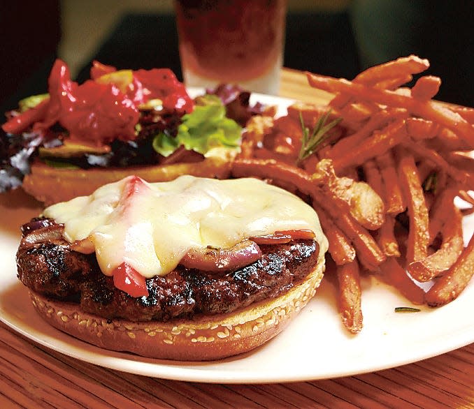 Cheeseburger and sweet potato fries at Northstar Café, shown here in a 2010 Dispatch file photo. Northstar's Short North location made Yelp's list of the top 100 burgers in America.