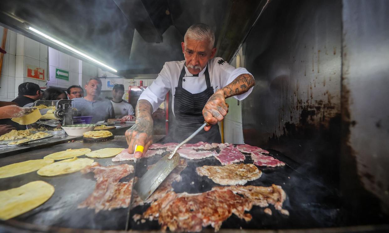 <span>‘Elemental and pure’: tacos being prepared the day after El Califa de León was awarded its Michelin star.</span><span>Photograph: Héctor Vivas/Getty Images</span>