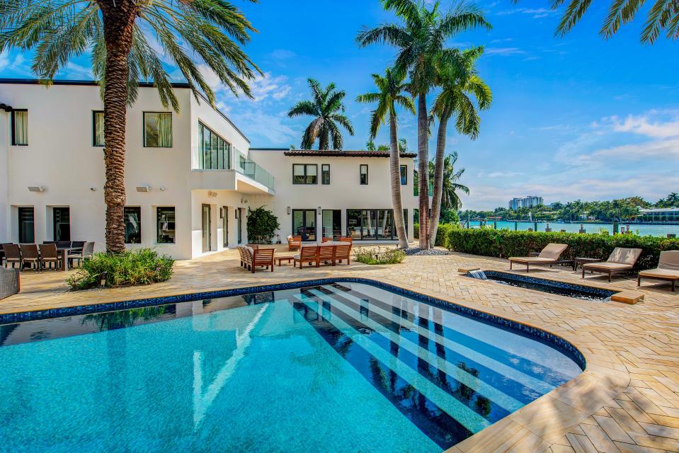 Out back, the property features a pool and a view of Biscayne Bay.