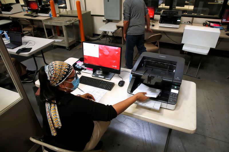 A county election worker tabulates ballots at the Clark County Election Center in North Las Vegas