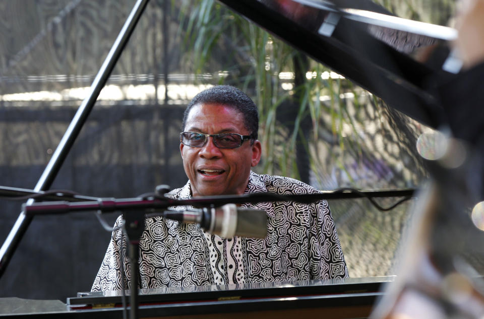 Herbie Hancock, performs at a sunrise concert marking International Jazz Day in New Orleans, Monday, April 30, 2012. The performance, at Congo Square near the French Quarter, is one of two in the United States that day; the other is in the evening in New York. Thousands of people across the globe are expected to participate in International Jazz Day, including events in Belgium, France, Brazil, Algeria and Russia. (AP Photo/Gerald Herbert)