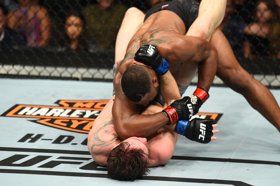 Tyron Woodley elbows Darren Till in their UFC welterweight championship fight during the UFC 228 event at American Airlines Center on Sept. 8, 2018 in Dallas, Texas. (Getty Images)