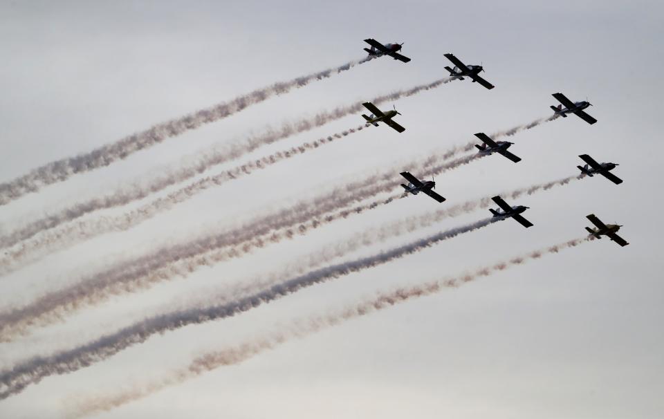 The SMOKE ON! Aviation team from Louisville flies overhead during the Thunder Over Louisville airshow on Saturday, April 20, 2024.