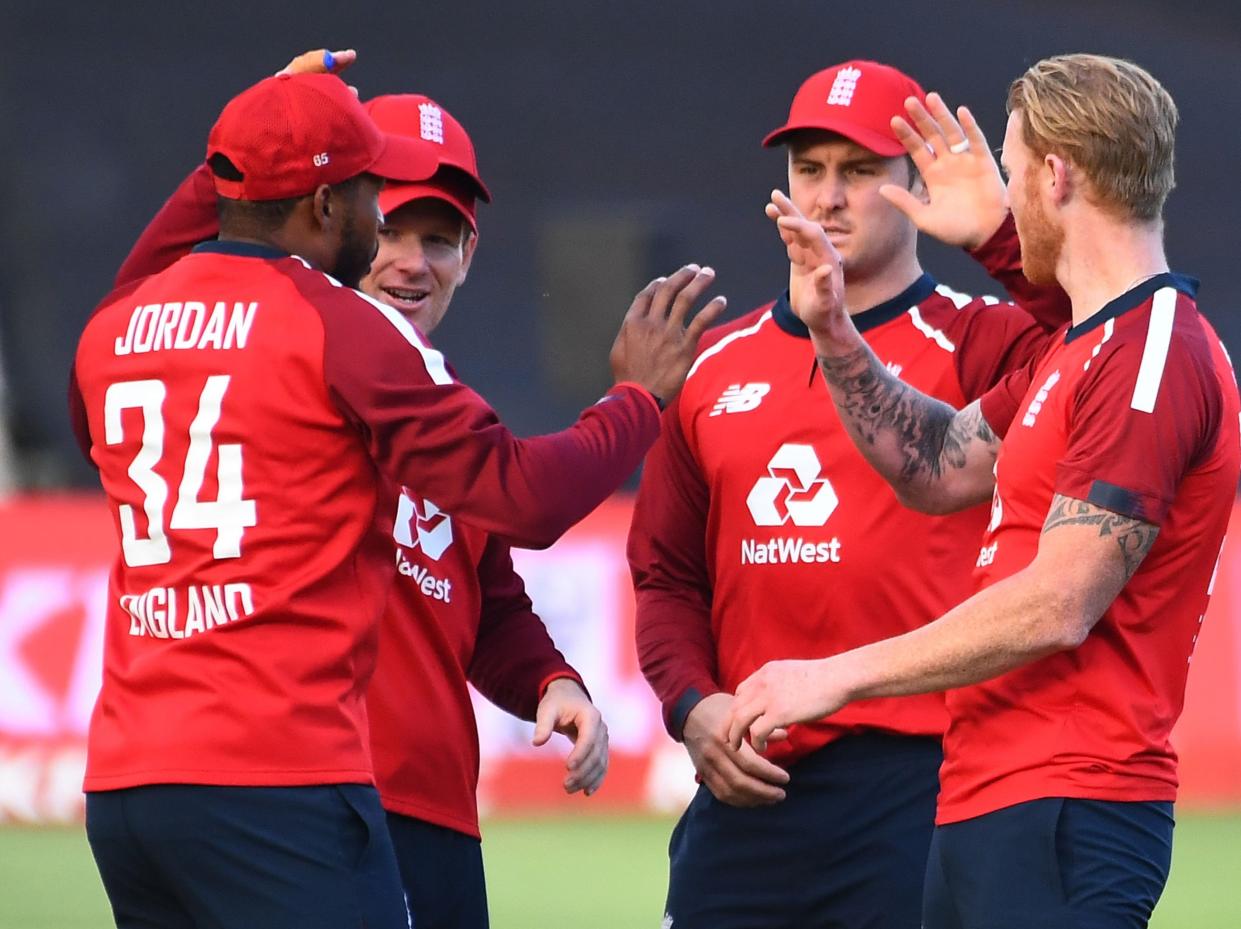 Chris Jordan celebrates with his England team-mates (AFP via Getty Images)