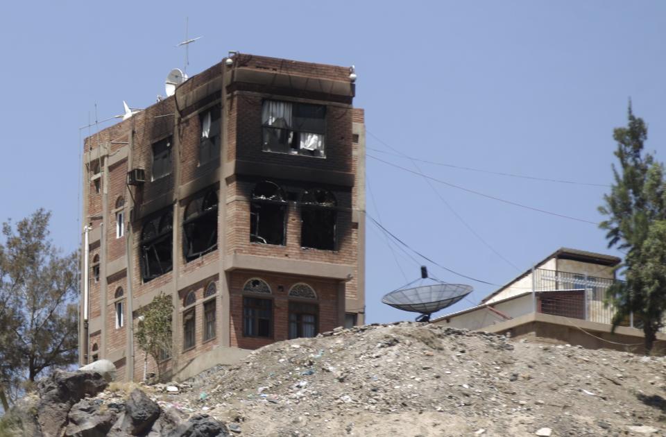 A building at Yemen's state-run television compound, damaged from shelling by Shi'ite Houthi rebels, is seen in Sanaa September 21, 2014. Shi'ite Houthi rebels and government forces fought for a fourth straight day in the Yemeni capital, residents said, despite the announcement of a U.N.-brokered agreement due to be signed later on Sunday. (REUTERS/Khaled Abdullah)