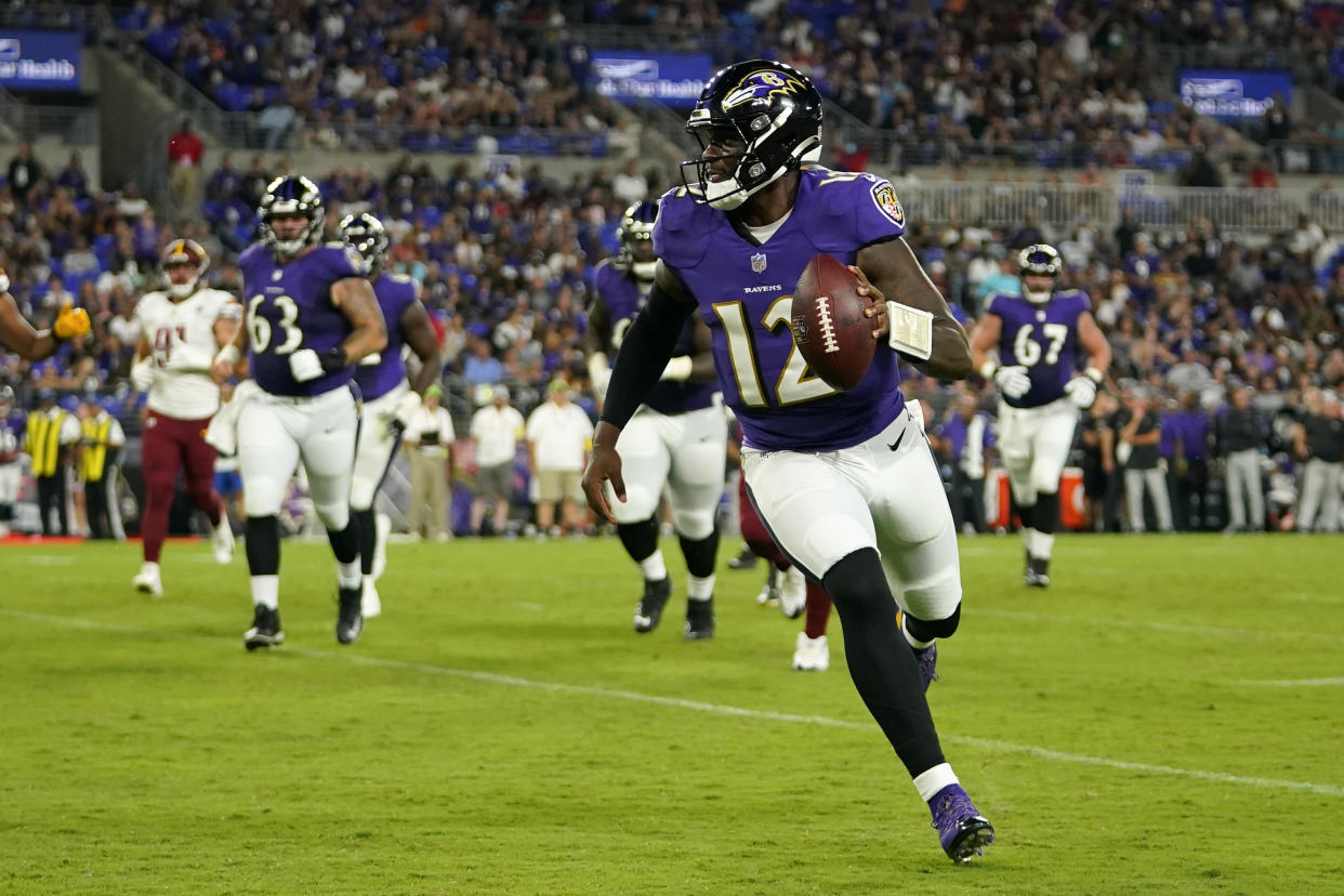 Baltimore Ravens quarterback Anthony Brown rushes for a touchdown in the second half of a preseason NFL football game against the Washington Commanders, Saturday, Aug. 27, 2022, in Baltimore. (AP Photo/Julio Cortez)
