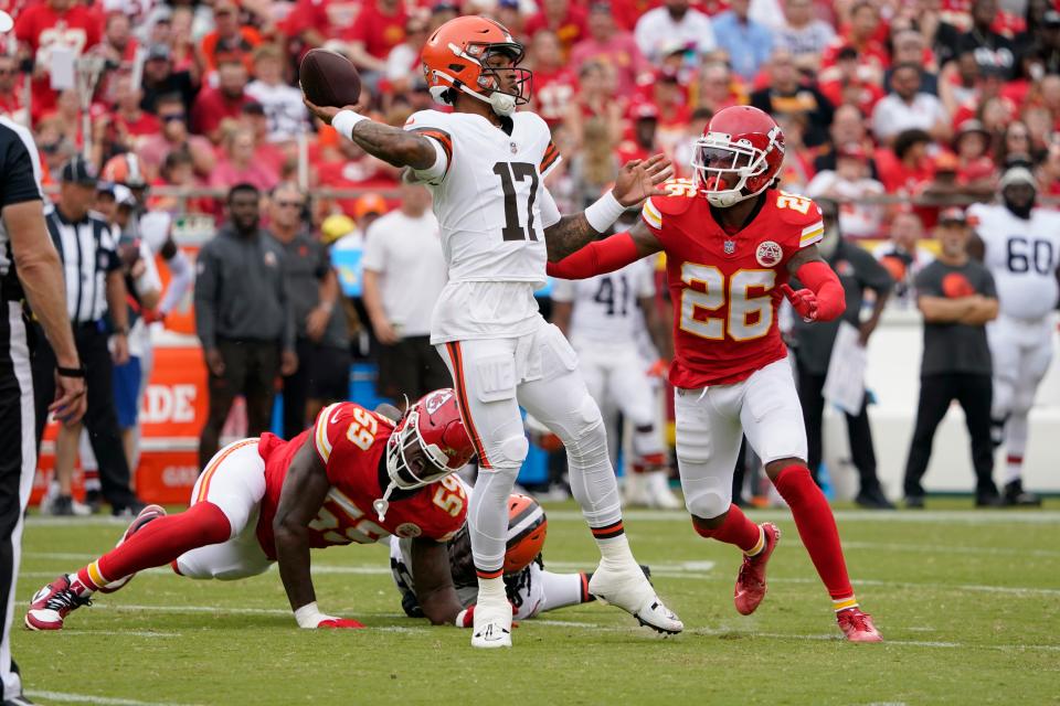 Browns quarterback Dorian Thompson-Robinson throws a first-half pass as Chiefs safety Deon Bush (26) defends, Saturday, Aug. 26, 2023.