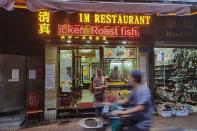 People eat at a halal restaurant in Guangzhou's Xiaobei neighborhood