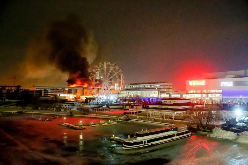 A massive blaze over the venue after an incendiary device was thrown (AP)