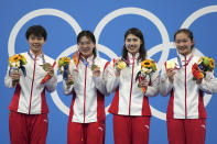 China's women's 4x200-meter freestyle relay team, from left, Yang Junxuan, Tang Muhan, Zhang Yifan and Li Bingjie pose with their gold medals at the 2020 Summer Olympics, Thursday, July 29, 2021, in Tokyo, Japan. (AP Photo/Matthias Schrader)