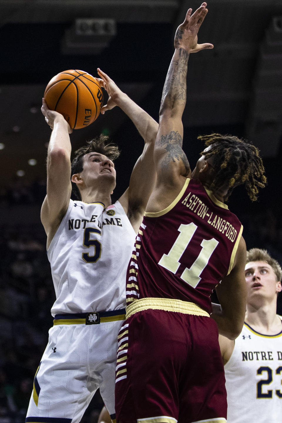 Notre Dame's Cormac Ryan (5) shoots as Boston College's Makai Ashton-Langford (11) defends during the second half of an NCAA college basketball game Saturday, Jan. 21, 2023 in South Bend, Ind. (AP Photo/Michael Caterina)