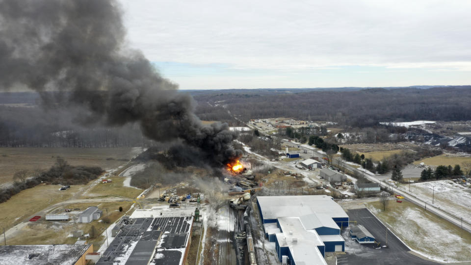 FILE - A plume rises from a Norfolk Southern freight train that derailed in East Palestine, Ohio, Feb. 4, 2023. After the catastrophic train car derailment in East Palestine, Ohio, some officials are raising concerns about a type of toxic substance that tends to stay in the environment. (AP Photo/Gene J. Puskar, File)