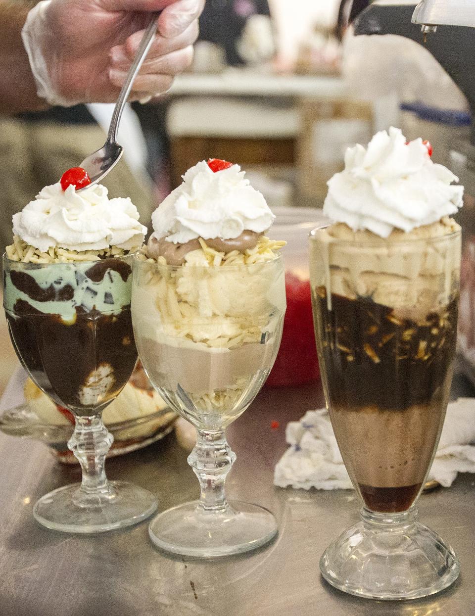 The finishing touches are placed on an ice cream sundae at the Sugar Bowl ice cream parlor in Old Town Scottsdale.