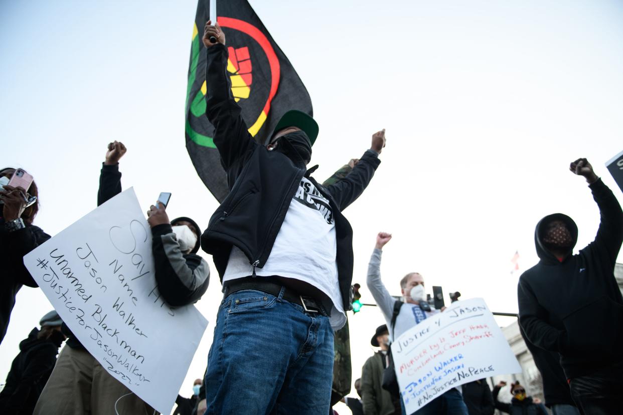 Demonstrators march through downtown Fayetteville during a Justice for Jason Walker demonstration on Friday, Jan. 14, 2022. Jason Walker, 37, was shot and killed on Saturday by an off-duty Cumberland County Sheriff’s deputy.