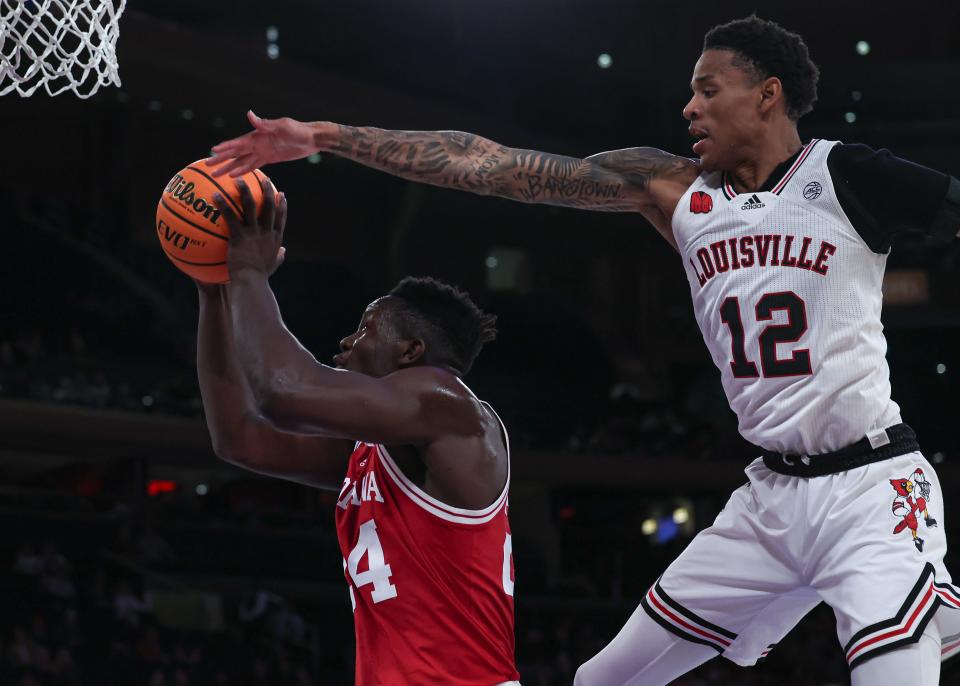 Nov 20, 2023; New York, NY, USA; Indiana Hoosiers forward Payton Sparks (24) drives to the basket as Louisville Cardinals forward JJ Traynor (12) defends during the second half at Madison Square Garden. Mandatory Credit: Vincent Carchietta-USA TODAY Sports