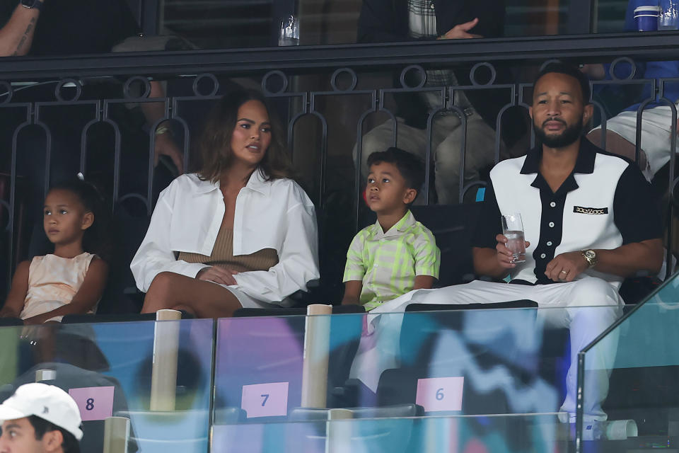 Chrissy Teigen and John Legend watch the women's artistic gymnastics preliminaries with their children on day two of the Paris 2024 Olympic Games at the Bercy Arena in Paris, France on July 28, 2024. (Photo by Naomi Baker/Getty Images)