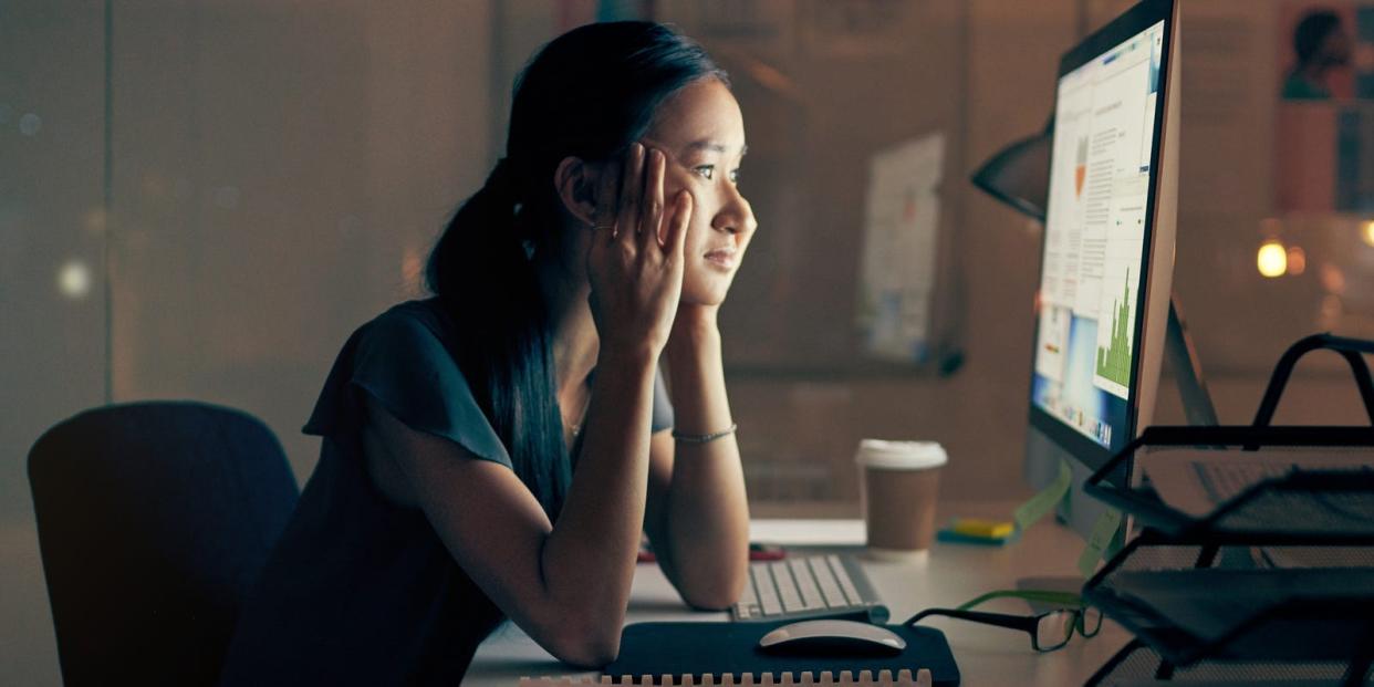 Woman working at home desktop computer