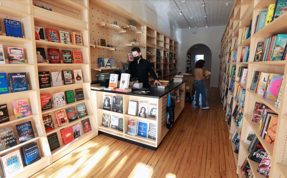 Chris Steib of Transom Books in Tarrytown, works at the register on Wednesday, November 24, 2021.