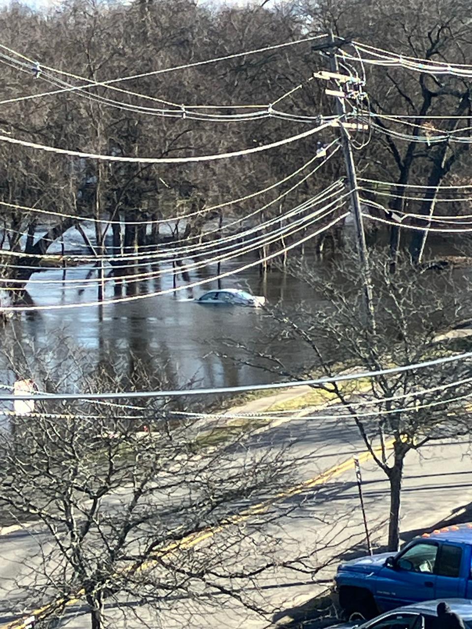 Car in water in Lincoln Park by train tracks, Tuesday, December 19, 2023.