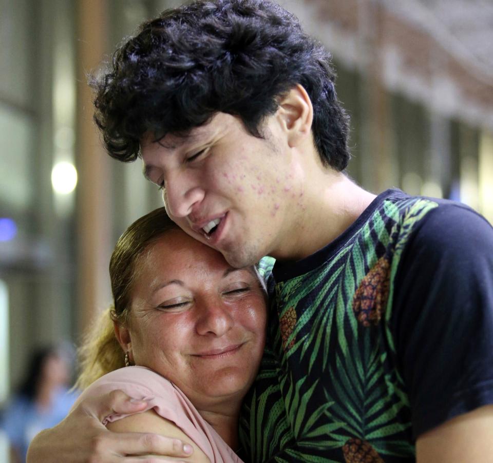 Francisco Galicia embraces his mother, Sanjuana Galicia, at the McAllen, Texas, Central Station, on Wednesday. (Photo: ASSOCIATED PRESS)