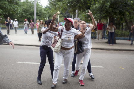 Cuban security personnel detain members of the Ladies in White dissident group during a protest on International Human Rights Day, Havana, December 10, 2015. REUTERS/Alexandre Meneghini