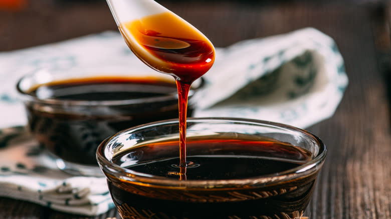 Molasses pouring from spoon