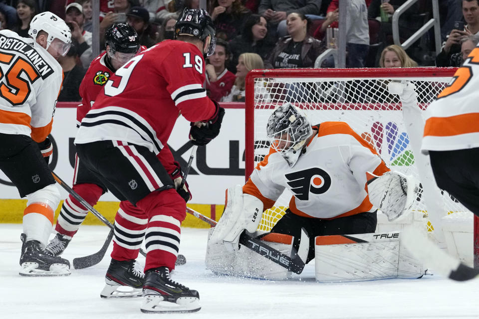 Philadelphia Flyers goaltender Felix Sandstrom, right, can't make a save a goal hit by Chicago Blackhawks center Jonathan Toews (19) during the second period of an NHL hockey game in Chicago, Thursday, April 13, 2023. (AP Photo/Nam Y. Huh)