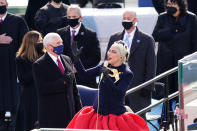 Lady Gaga sings the National Anthem during the 59th Presidential Inauguration at the U.S. Capitol for President-elect Joe Biden in Washington, Wednesday, Jan. 20, 2021. Former Vice President Mike Pence is on left. (Kevin Dietsch/Pool Photo via AP)