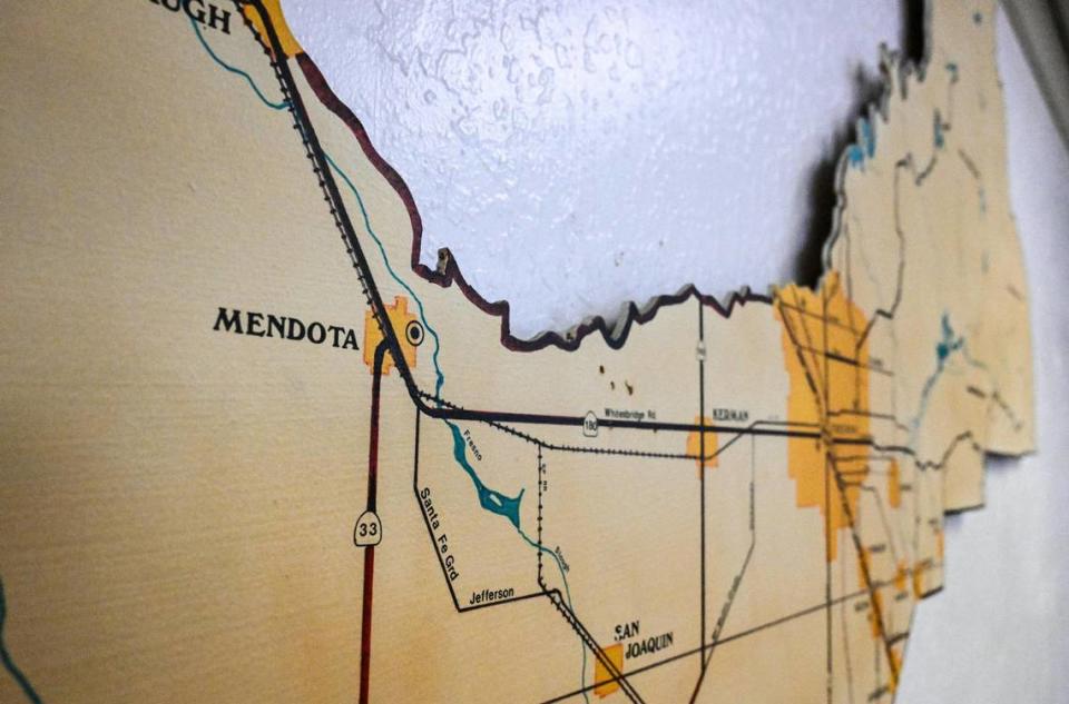A large wooden map in the Mendota City Council Chambers locates Mendota on the western side of Fresno County.