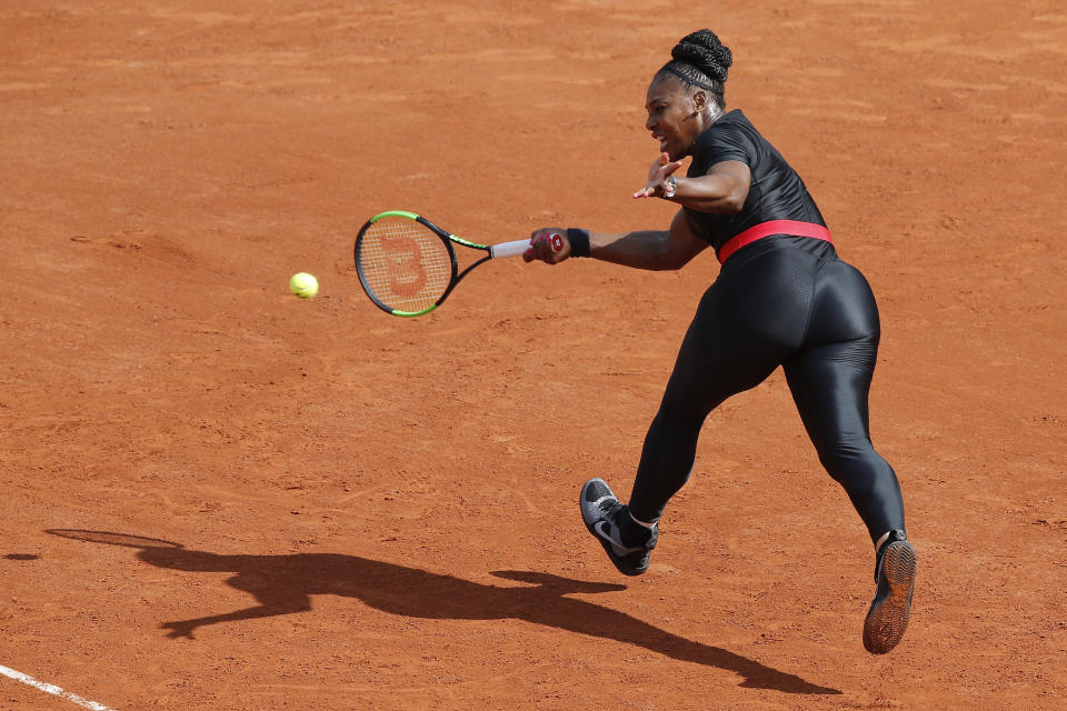 FILE - In this May 29, 2018 file photo, Serena Williams of the U.S. returns a shot against Krystyna Pliskova of the Czech Republic during their first round match of the French Open tennis tournament at the Roland Garros stadium in Paris. Serena Williams will no longer be allowed to wear her sleek, figure-hugging catsuit at the French Open. The French Tennis Federation president, Bernard Giudicelli, says the tournament that Williams has won three times is introducing a dress code to regulate players' uniforms because "I think that sometimes, we've gone too far." (AP Photo/Michel Euler, File)