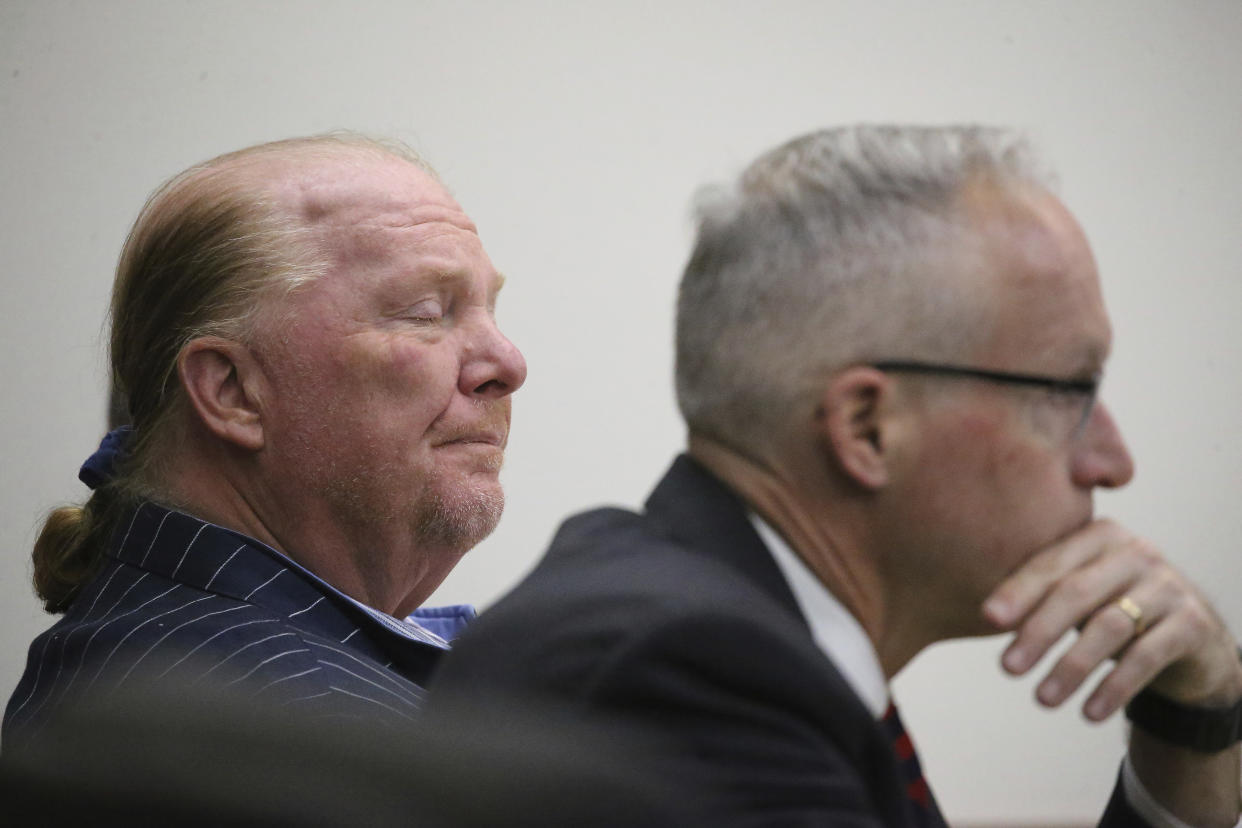 Celebrity chef Mario Batali is seated at Boston Municipal Court on the second day of his sexual misconduct trial on Tuesday, May 10, 2022 in Boston. Batali pleaded not-guilty to a charge of indecent assault and battery in 2019, stemming from accusations that he forcibly kissed and groped a woman after taking a selfie with her at a Boston restaurant in 2017. (Stuart Cahill/The Boston Herald via AP, Pool)