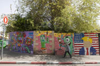 Graffiti adorns a wall in the Jaffa neighborhood of Tel Aviv, Israel, Wednesday, April 21, 2021. Historic Jaffa's rapid gentrification in recent years is coming at the expense of its mostly Arab lower class. With housing prices out of reach, discontent over the city’s rapid transformation into a bastion for Israel’s ultra-wealthy is reaching a boiling point. (AP Photo/Sebastian Scheiner)