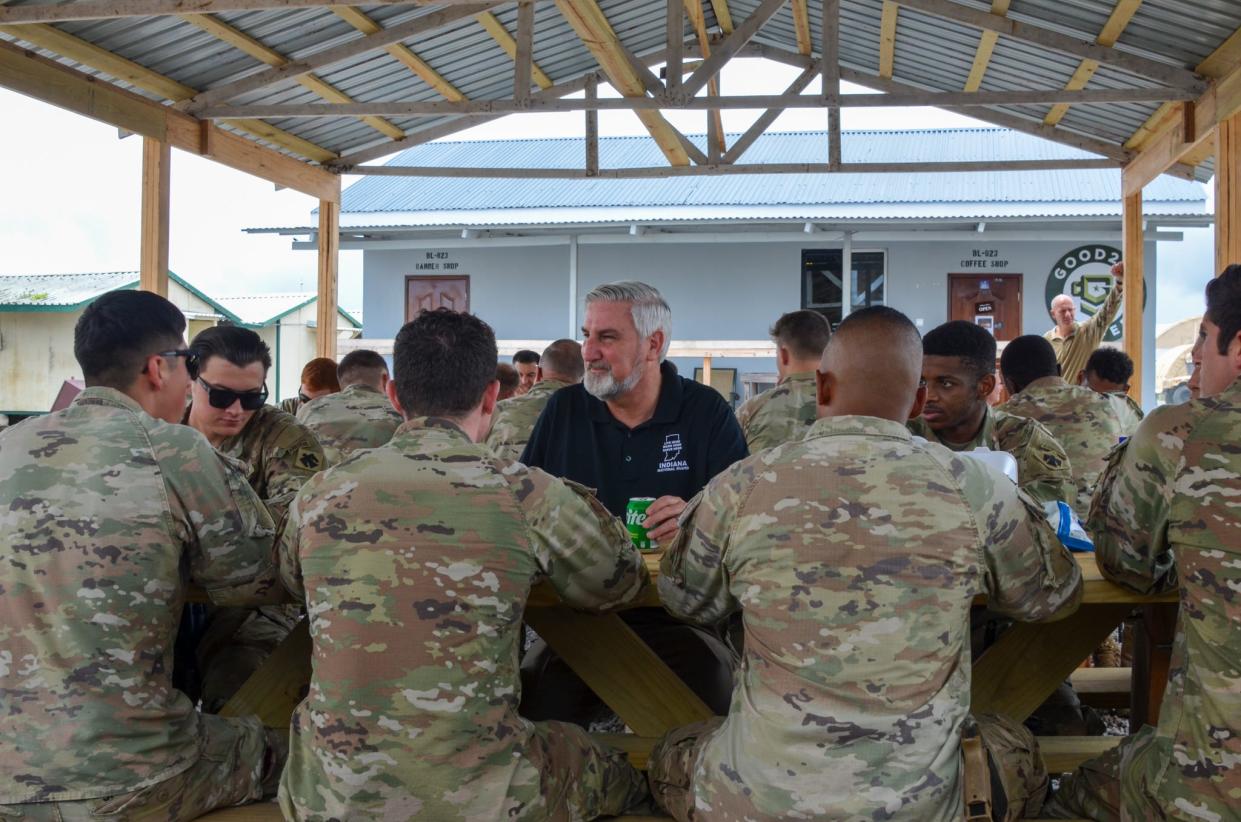 Indiana Gov. Eric Holcomb dines with the Indiana National Guard for Thanksgiving 2023 at Camp Simba, Kenya, who are serving Operation Enduring Freedom.