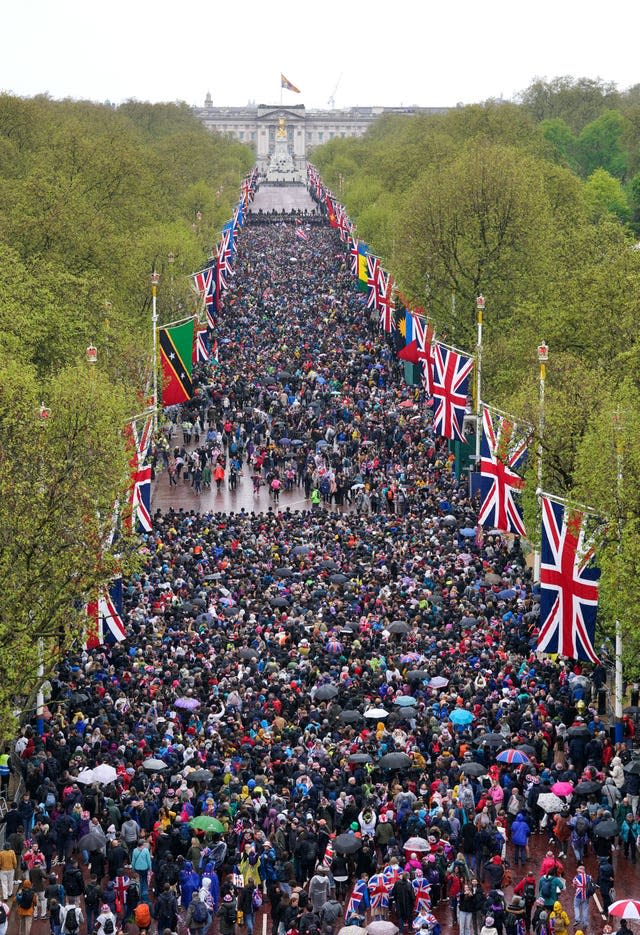 Crowds line The Mall after the coronation ceremony of the King and Queen Camilla in central London