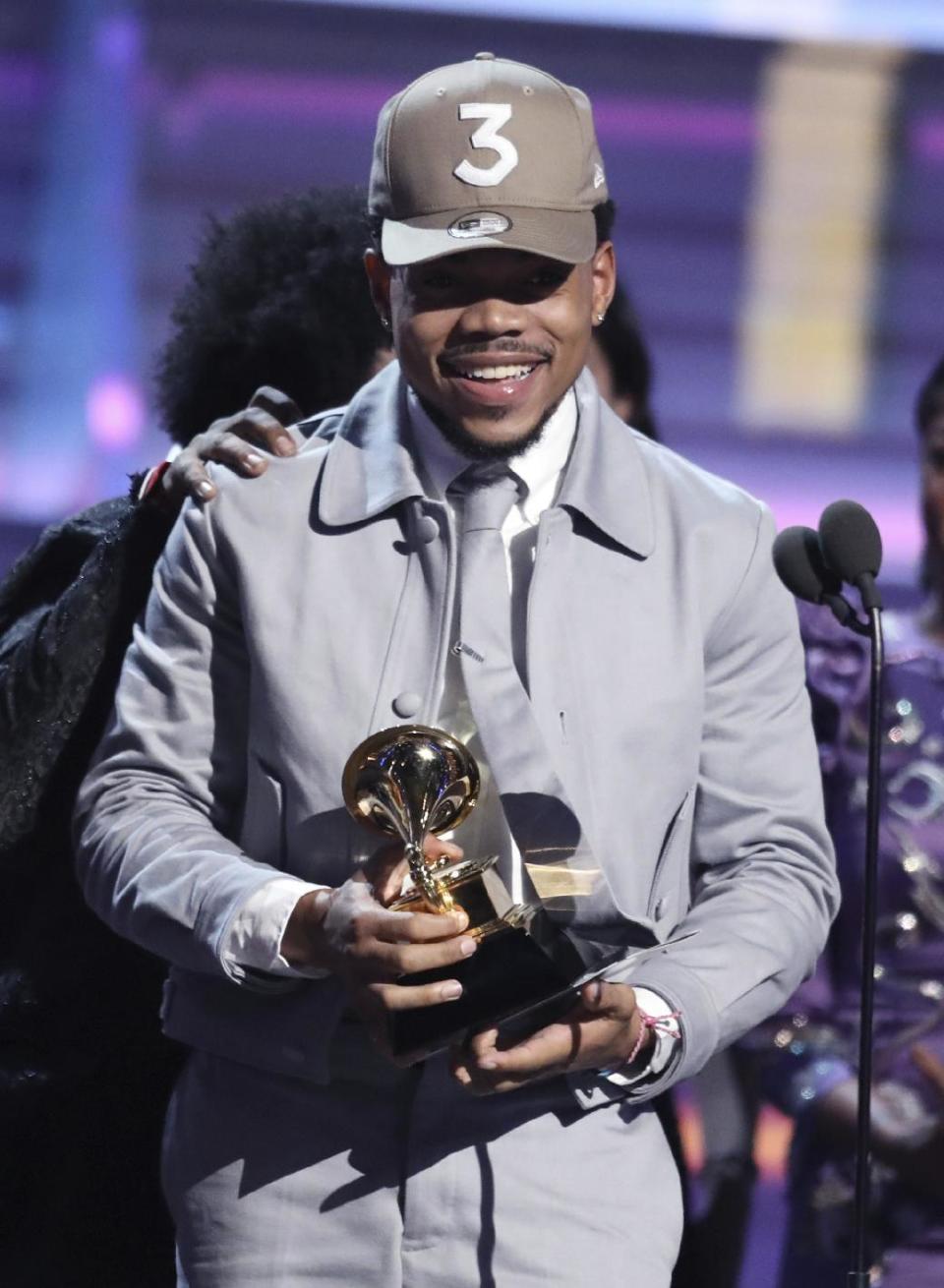 Chance The Rapper accepts the award for best rap album for "Coloring Book" at the 59th annual Grammy Awards on Sunday, Feb. 12, 2017, in Los Angeles. (Photo by Matt Sayles/Invision/AP)