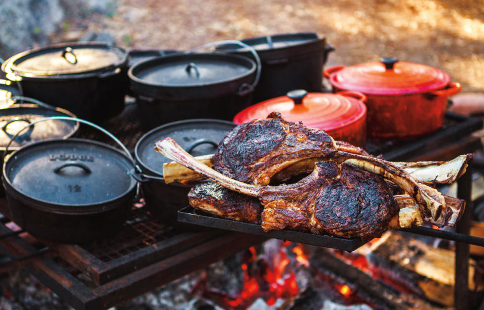 Tomahawk steaks at a riverside "Chuck Wagon" dinner at the Resort at Paws Up