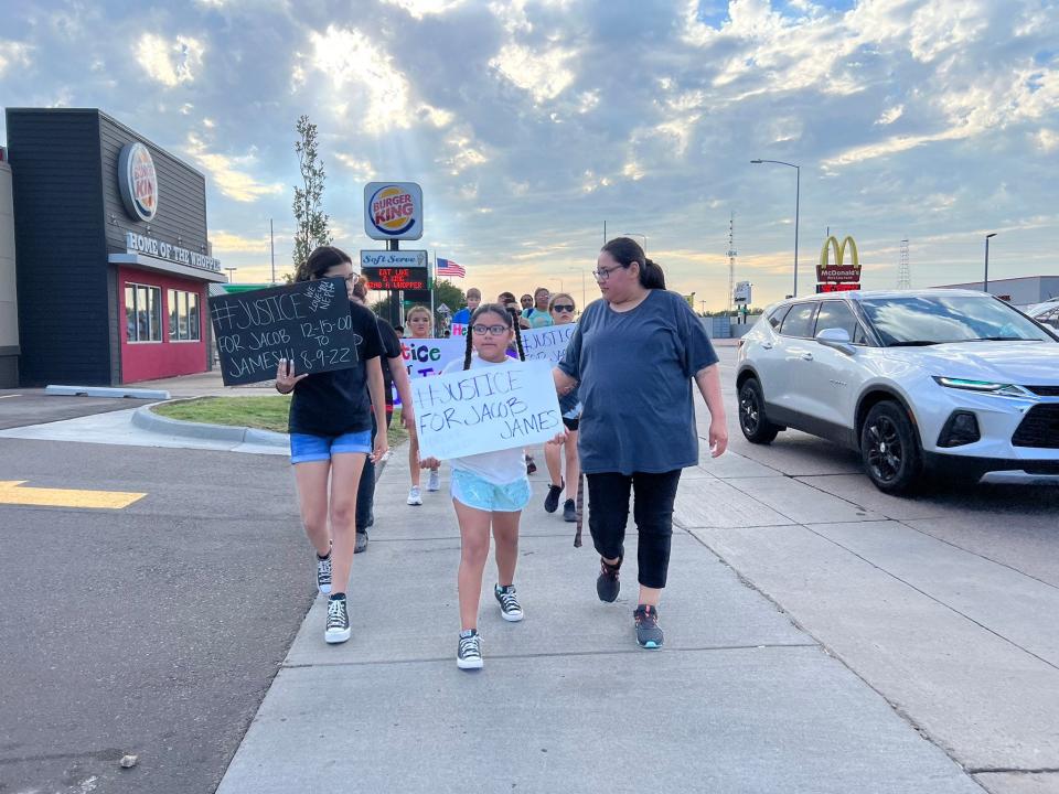 Family of Jacob James begin walking down to Mercato from Burger King on 12th Street in Sioux Falls.