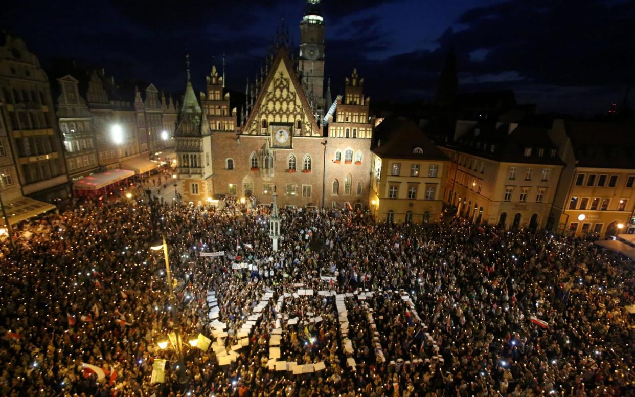 People attend a protest against supreme court legislation in Wroclaw - REUTERS